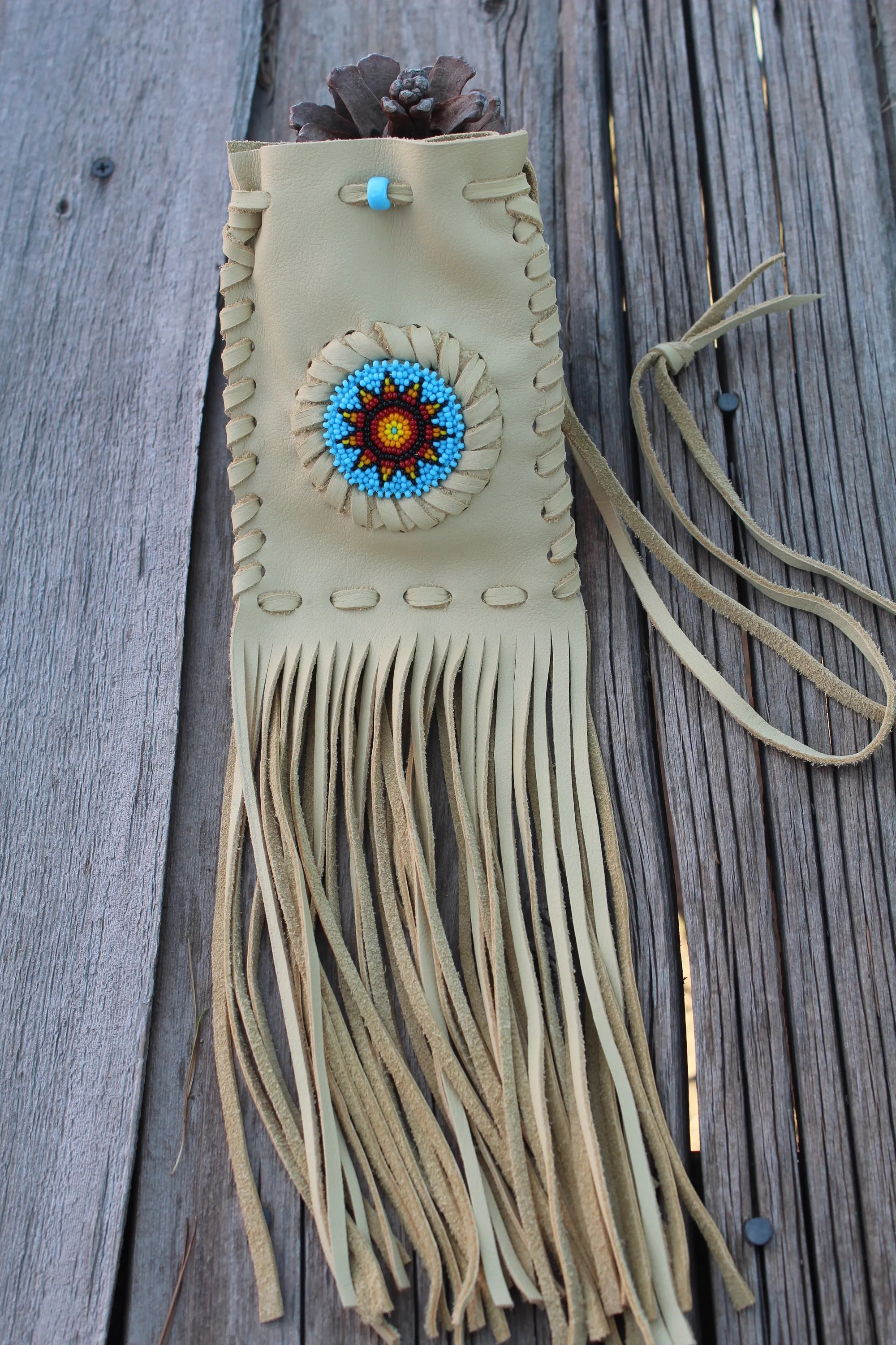 Beaded fringed medicine bag, beaded leather pouch